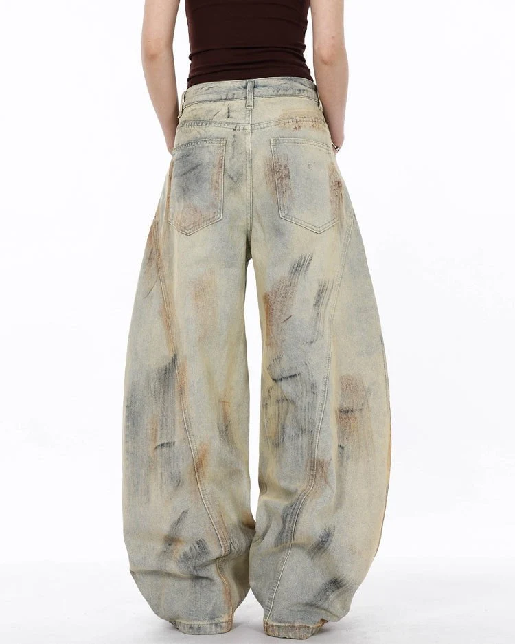 Arc-Cut Distressed Wide-Leg Jeans