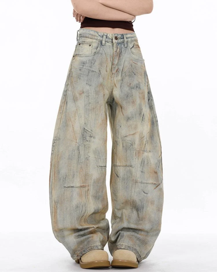 Arc-Cut Distressed Wide-Leg Jeans